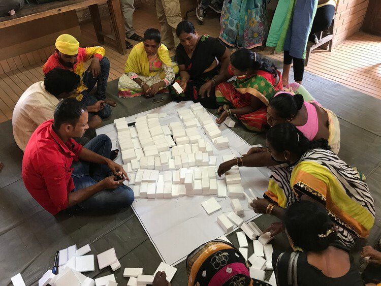 young designers brainstorming sustainable design ideas in a shared space