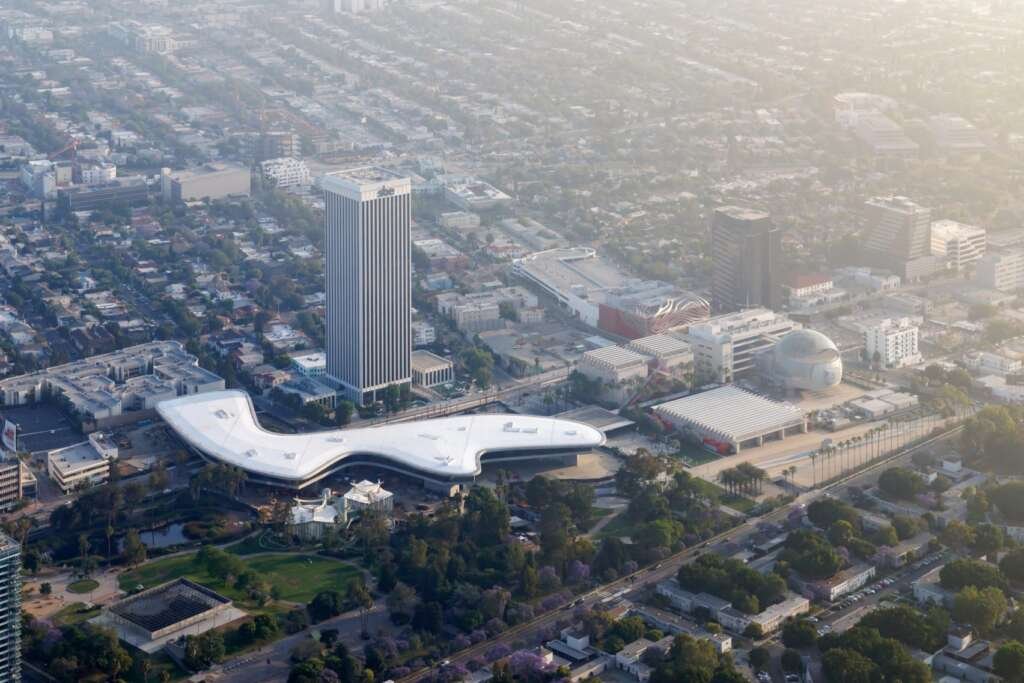aerial view of the david geffen galleries showing its fluid, amoeba-like design across wilshire boulevard.