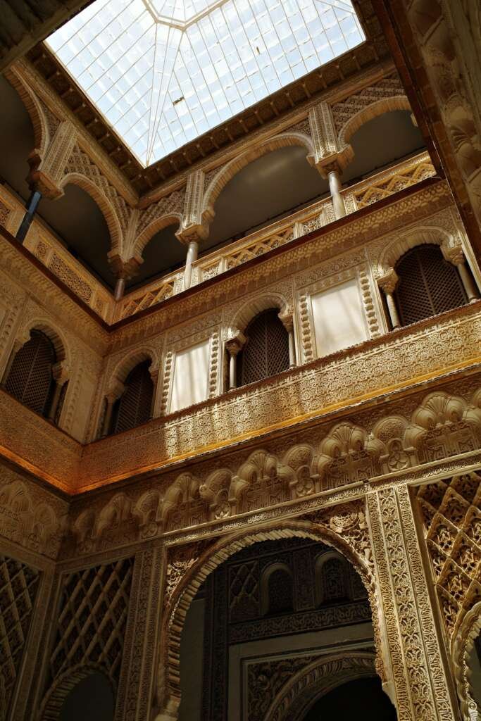 Architectural Photography: Revealing What Drawings Can’t 1 courtyard of a classical building lit by natural sunlight through its roof