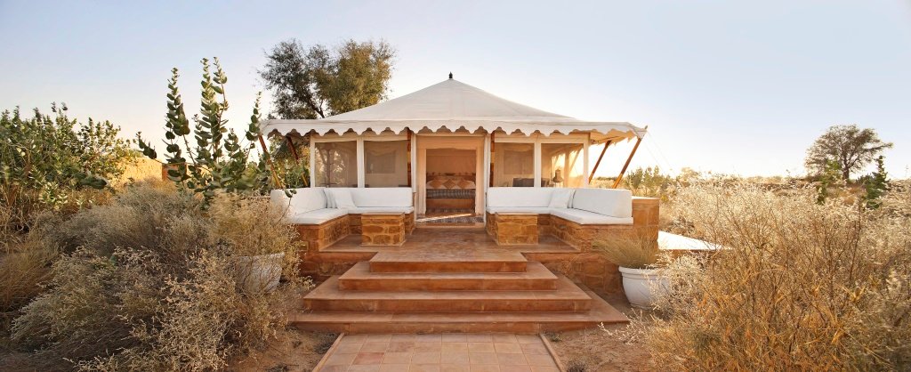 the serai desert camp in jaisalmer with vibrant textiles and local craftsmanship, offering a unique cultural staycation experience